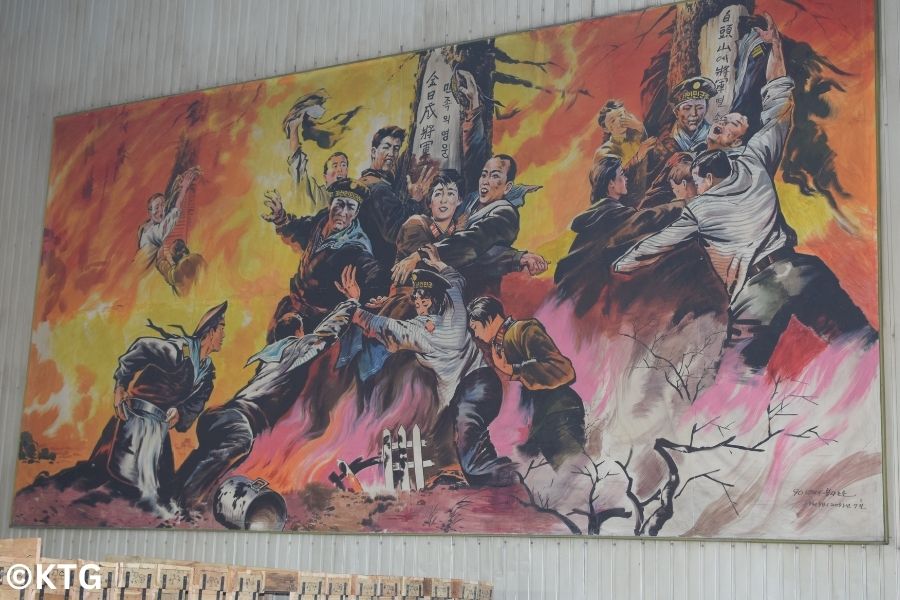 North Korean propaganda poster at the Taean glass factory in north Korea Tour arranged by KTG Tours