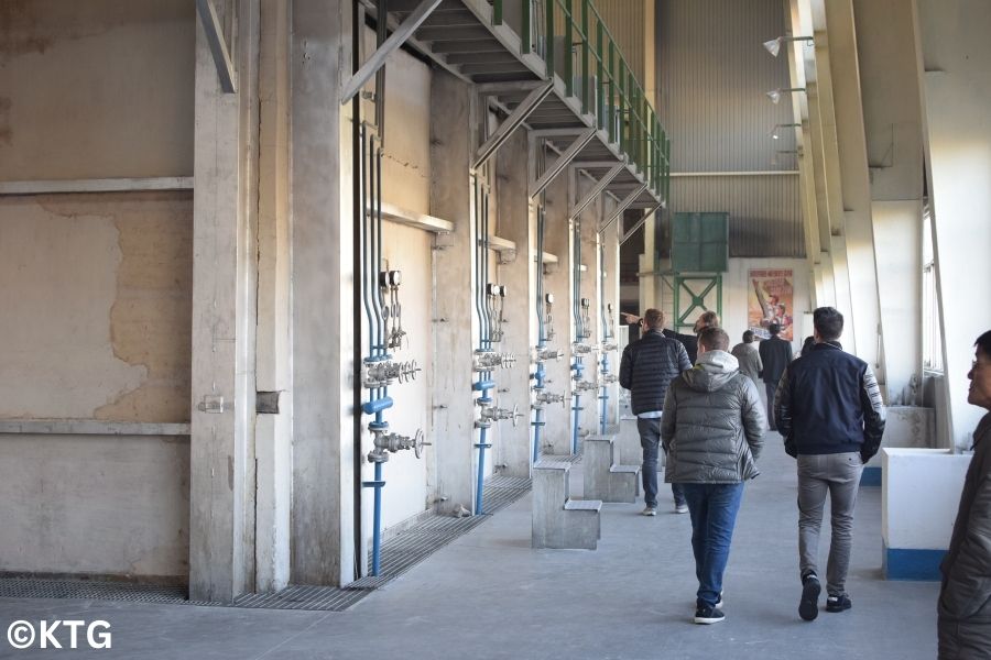 KTG travellers walking around the Tae'an Glass Factory in Nampo, North Korea (DPRK)