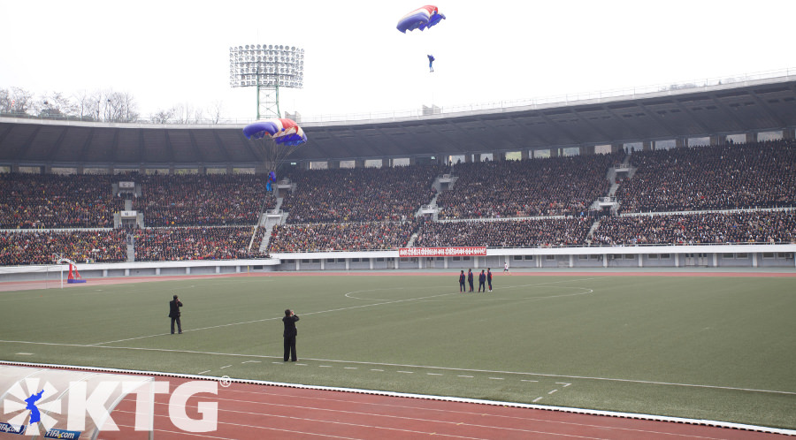 Parachutists landing in Kim Il Sung Stadium in Pyongyang capital of North Korea, DPRK. Picture taken by KTG Tours