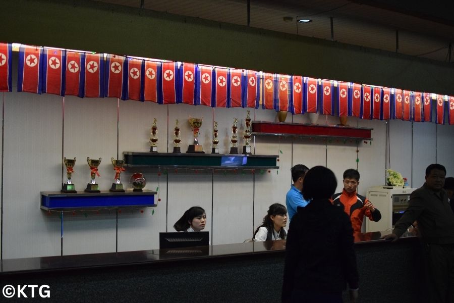 Reception at the Gold Lane Bowling Alley in Pyongyang, North Korea (DPRK). You can see a large number of North Korean flags as this picture was taken on a national holiday