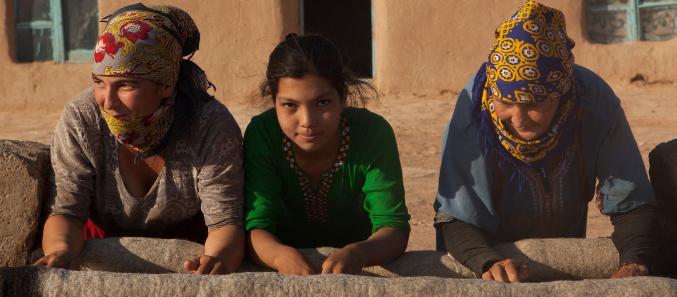 Turkmen women and girl making a carpet, Turkmenistan