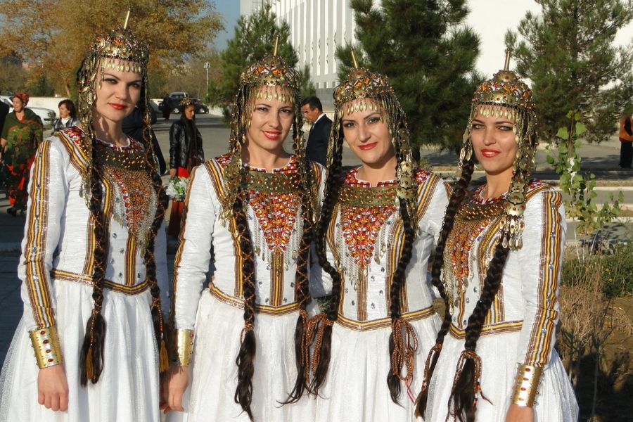 Young women in Turkmenistan in traditional turkmen clothes