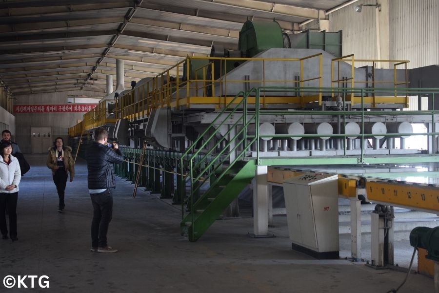 KTG travellers taking pictures at the Taean glass factory in north Korea Tour arranged by KTG Tours