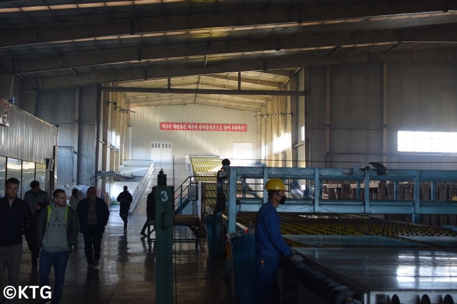 North Korean workers at the Tae'an Friendship Glass factory in Nampo, North Korea