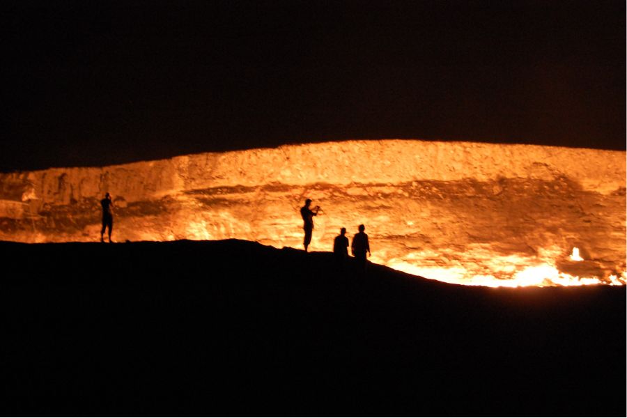 building brightly lit Darwaza crater at night in Turkmenistan