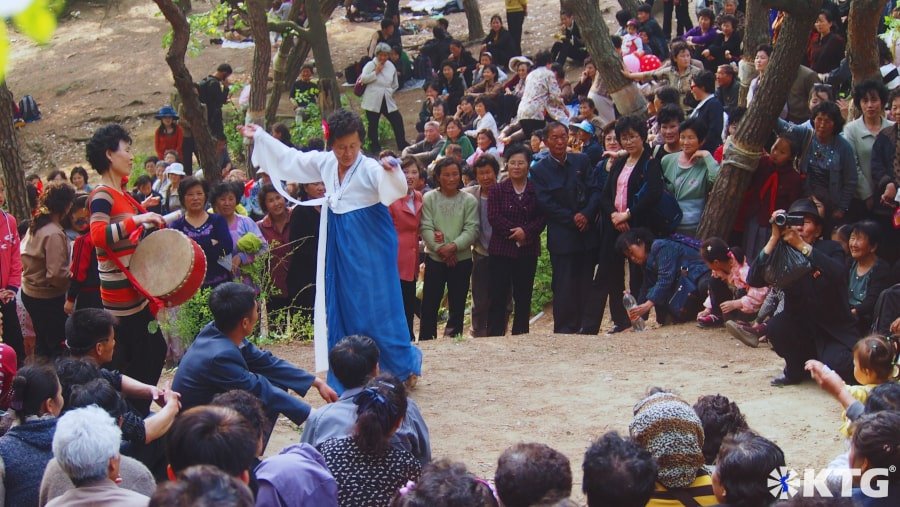 North Koreans dancing, singing and playing drums on Moran Hill on May Day. Picture of Pyongyang North Korea taken by KTG Tours