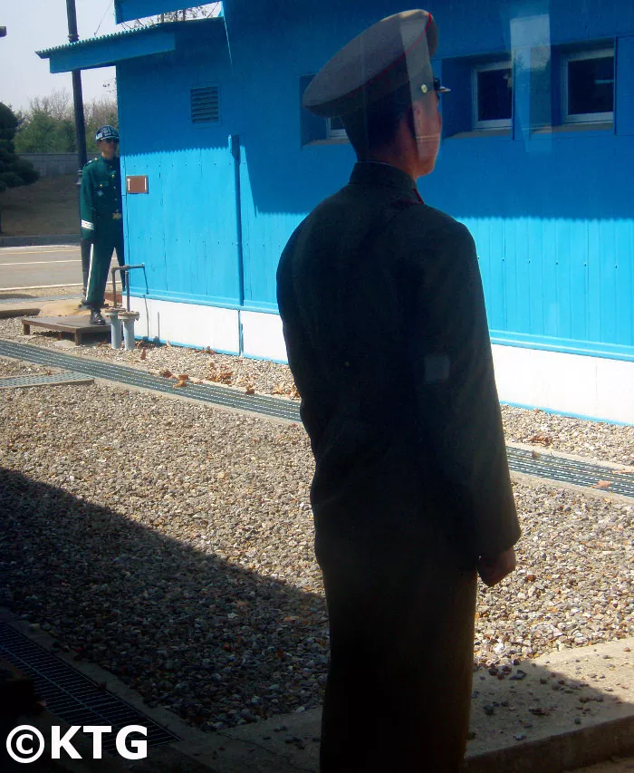 North and South Korean soldiers face each other at the Panmunjom in the DMZ. Trip arranged by KTG Tours