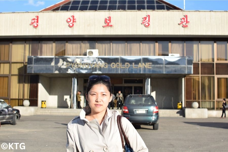 Local North Korean guide outside the Pyongyang Gold Lane Bowling Alley